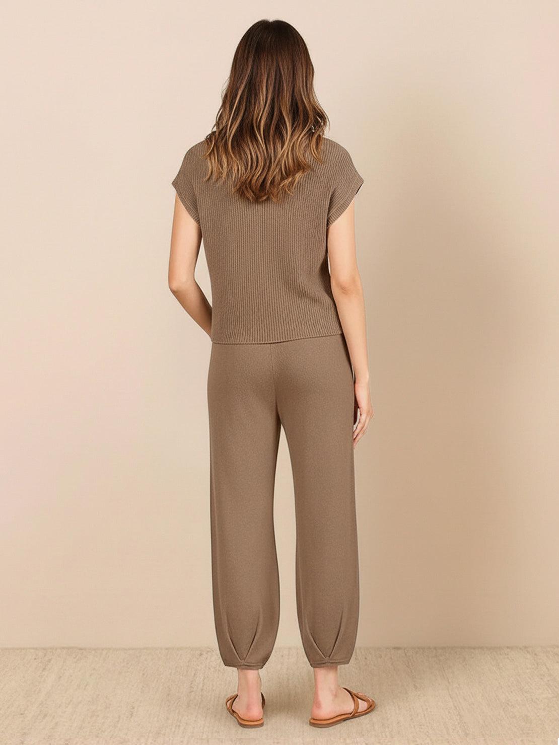 Woman wearing comfy couture knit sweater two-piece set in soft neutral tones