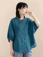 Relaxed loose breathable linen blouse in teal with button-down front and short sleeves