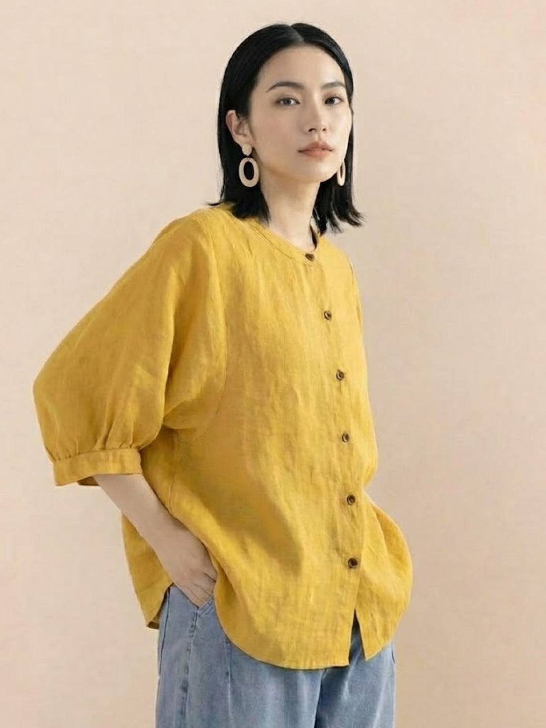 Relaxed loose breathable linen blouse in vibrant yellow with button-down front and 3/4 sleeves