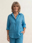 woman wearing relaxed shirt and trousers two-piece set in soft breathable fabric