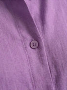 Monochrome relaxed shirt and trousers two-piece set on model standing outdoors