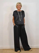 Silken Escape satin two-piece set with flowing top and wide-leg pants in champagne color