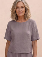 Woman wearing a soft-tailored, loose fit co-ord set with wide-leg trousers in a relaxed, breathable fabric