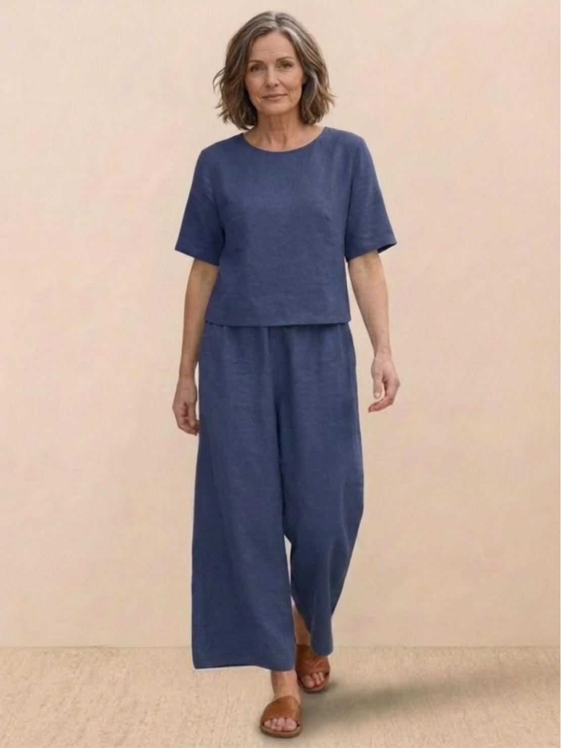 Woman wearing The Meadow loose fit co-ord set with soft-tailored top and wide-leg bottoms in solid color.