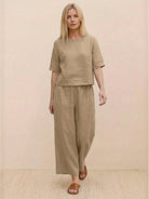 Loose fit co-ord set featuring a soft-tailored top with wide sleeves and wide-leg bottoms in breathable poly-cotton fabric.