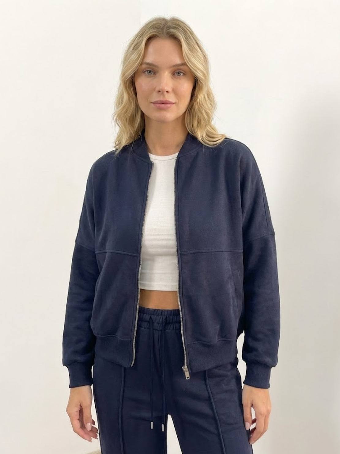 The Voyager Zip Set two-piece zip-front sweatshirt and wide-leg joggers in neutral tones for travel and casual wear