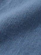 Close-up texture of blue lightweight cotton fabric for a breathable cotton dress