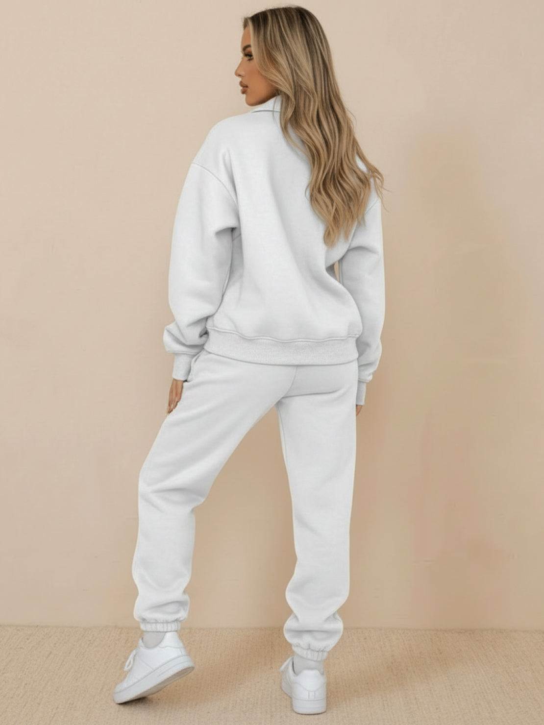 Woman wearing ultra-soft and comfy co-ord tracksuit set in light gray, back view