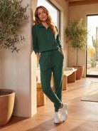 Unisex half-zip pullover and sweatpants set in soft fabric for casual comfort and travel
