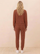 Unisex half-zip pullover and sweatpants set in soft fabric for casual comfort and relaxed fit