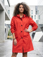 Water-resistant oversized hooded windbreaker rain jacket with multiple pockets and packable design