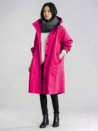 Water-resistant oversized hooded windbreaker rain jacket with multiple pockets and adjustable waist for outdoor activities