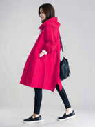 Water-Resistant Oversized Windbreaker rain jacket with hood and multiple pockets for outdoor activities