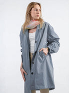 Water-Resistant Oversized Windbreaker rain jacket with hood and multiple pockets for outdoor activities